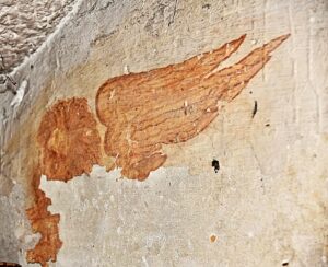 Leone Marciano che si trova nel sottoscala, l'opera è la più danneggiata poiché gli fu costruita una scala ai tempi di Lodovico Melzi